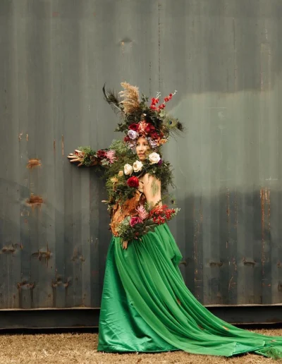 Felicity wearable art in front of shed wall